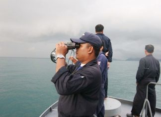 A Navy search and rescue team scours the horizon for signs of the missing Russian tourist.